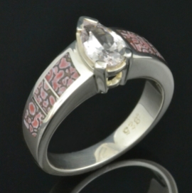 Pink dinosaur bone ring with white sapphire set in sterling silver.